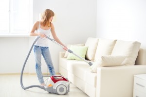 girl cleaning sofa